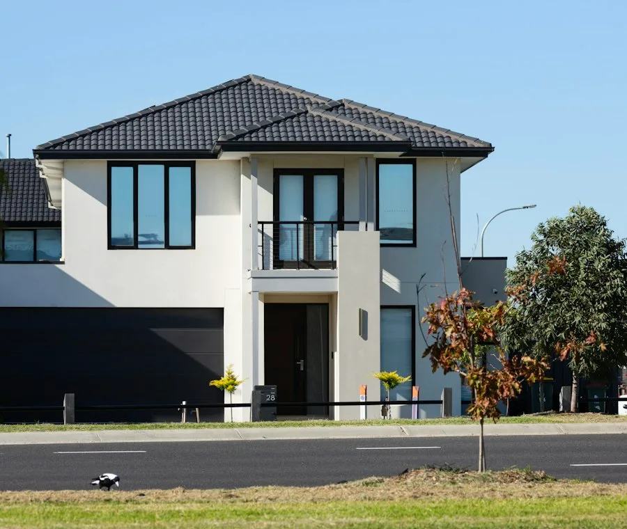 New construction two-story home with an insulated sectional garage door