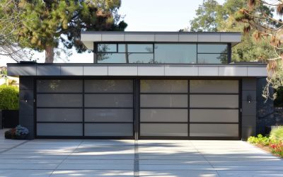 A detailed view of a modern two-car garage. The garage is part of a stylish contemporary home